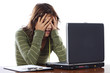 Beautiful frightened girl while looking at the laptop