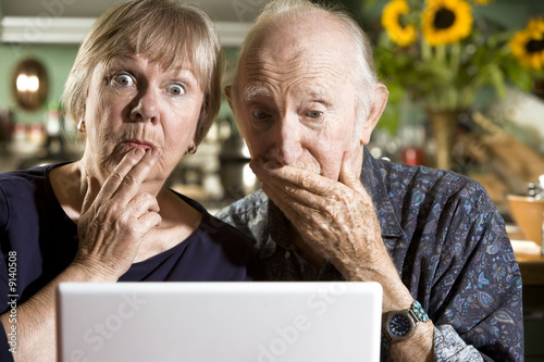 Photo: Perplexed Senior Couple with a Laptop Computer Perplexed Senior Couple with a Laptop Computer