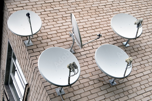 Photo: Five satellite antennas on the home front Five satellite antennas on the home front