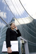 Businesswoman Sitting Outside with a Laptop