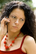outdoor portrait of woman on phone geting bad news..