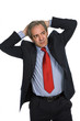 Businessman in a suit gestures with a headache