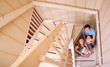 Happy young family of four at their home