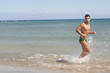 man running in the seaside under the sun