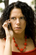 outdoor portrait of woman on phone getting bad news