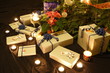 Christmas presents and candles under the tree Christmas presents and candles under the tree