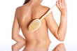 Photo of the woman with brush on back and reflexion in water