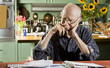 Elder Man at Home with Bills