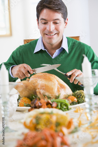 Photo: Man Excitedly Carving A Turkey Man Excitedly Carving A Turkey