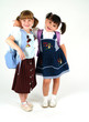 pretty smiling school girls going back to school