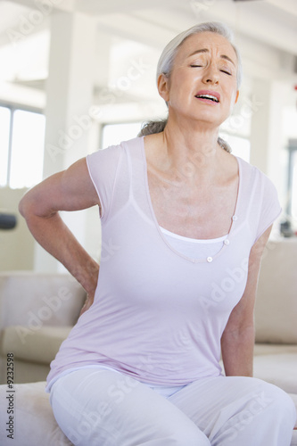 Foto: Woman With Back Pain Woman With Back Pain