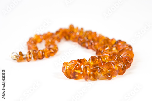 Foto: Amber necklace on white background Amber necklace on white background