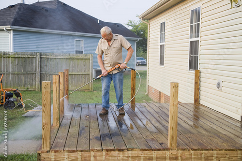 Photo: Contractor pressure washing deck , getting home ready to sell Contractor pressure washing deck , getting home ready to sell