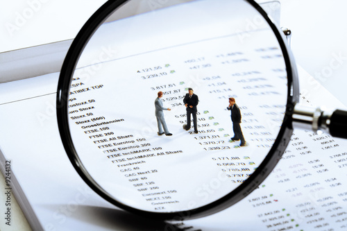 Photo: Magnifying glass, quotations sheet and figurines Magnifying glass, quotations sheet and figurines