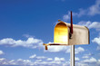 Mailbox against clouds