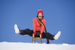 Young woman riding sledge