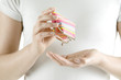 Woman holding change purse, close-up