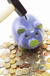 Hammer over piggy bank