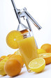 Fruit press and oranges