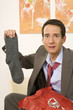 Man sitting on sofa, holding socks
