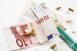Ten euro note and pills on letter of referral