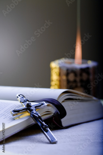 Photo: Old Cross and the Holy Bible laying on the table Old Cross and the Holy Bible laying on the table