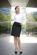 Businesswoman outside a modern building Businesswoman outside a modern building