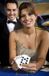 Beautiful Young Woman with Royal Flush Poker