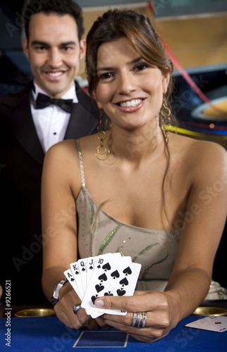 Photo: Beautiful Young Woman with Royal Flush Poker Beautiful Young Woman with Royal Flush Poker