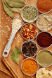 variety of spices on bamboo cutting board