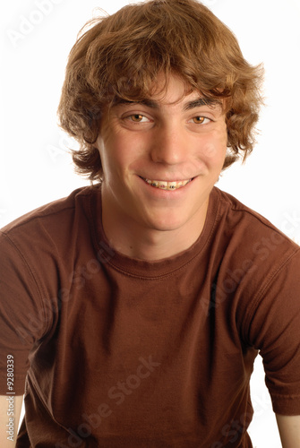 Photo: attractive fourteen year old boy with braces on his teeth.. attractive fourteen year old boy with braces on his teeth..