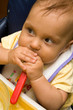 Little baby sitting comfort and eating.