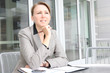 A pretty young business woman at company office building