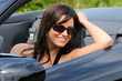 Beautiful Brunette Young Woman Sat In A Convertible Sports Car