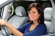 Attractive Woman Sat In The Drivers Seat Of A Family Vehicle