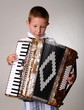 Young boy playing a 48 base accordion