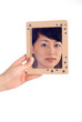 Love lady looking at mirror with wooden boarder