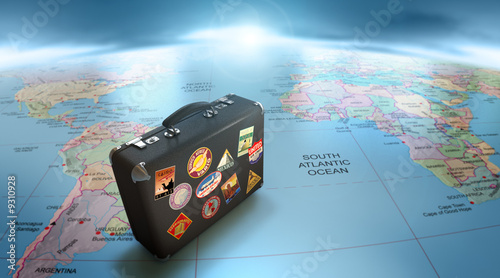 Illustration: Vintage suitcase over world map Vintage suitcase over world map