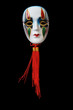 Nice ceramic venetian mask hanging on dark background