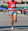 Finishing run woman at the marathon competition