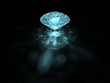 A bluish brilliant cut diamond on dark background