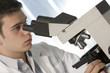 Scientist using microscope chemistry related or medical design