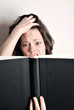 confused woman reading a book