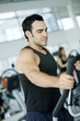Man working out at the gym on the stepper.