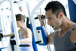 Man and woman at the gym working out..