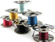 Bobbins of vibrantly colored thread isolated on white Bobbins of vibrantly colored thread isolated on white