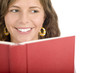 Young girl looking over book