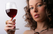 Portrait of beautiful woman with glass red wine