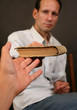 The old book in a hand of the woman and the man The old book in a hand of the woman and the man