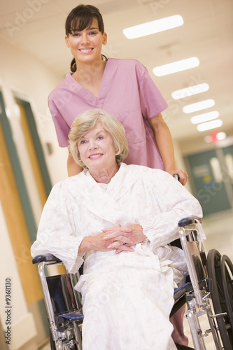 Photo: A Nurse Pushing A Senior Woman In A Wheelchair A Nurse Pushing A Senior Woman In A Wheelchair